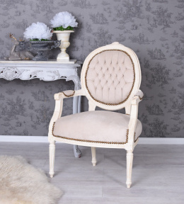 Beżowy fotel tapicerowany z podłokietnikami Ludwik XVI